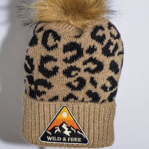 Leopard print stocking cap with "Wild and Free" patch